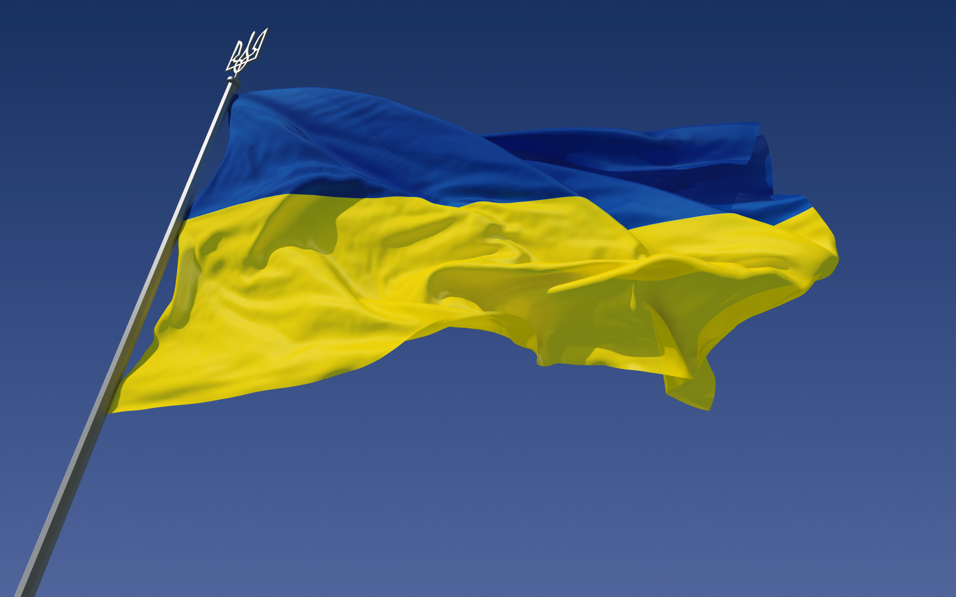 The Ukraine flag against a blue sky