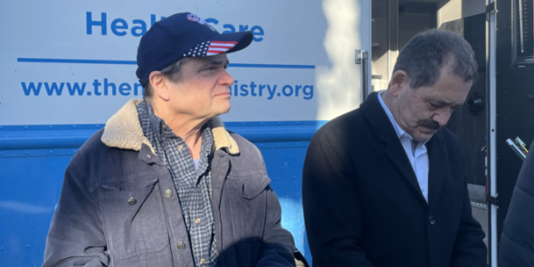 Representatives Quigley and Chuy Garcia help distribute food with The Night Ministry