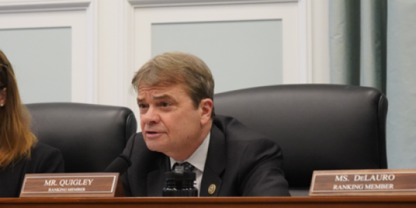Rep Quigley speaking from a dais during an appropriations subcommittee hearing