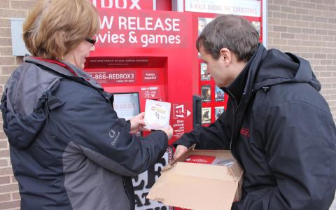 Rep. Quigley learned how to fully service a Redbox machine from Redbox Field Merchandiser Barb Conrath. 