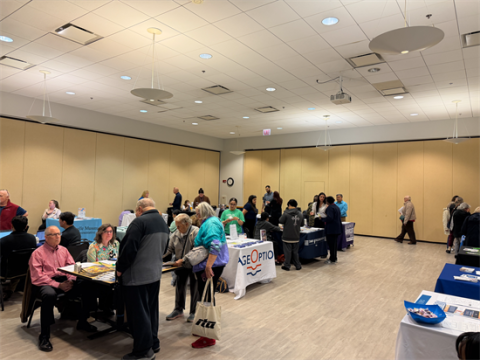 Senior citizens visit different tables at Quigleys Free Senior Fair