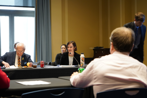 a meeting room with MQ at the head