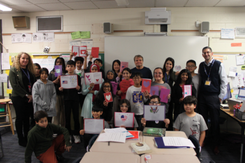 MQ with students holding the valentines they made