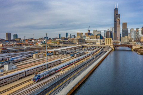 A photo of the skyline of Chicago with rail tracks in the foreground