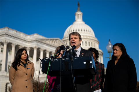 Mike Quigley speaking at a press conference in front of the Capitol