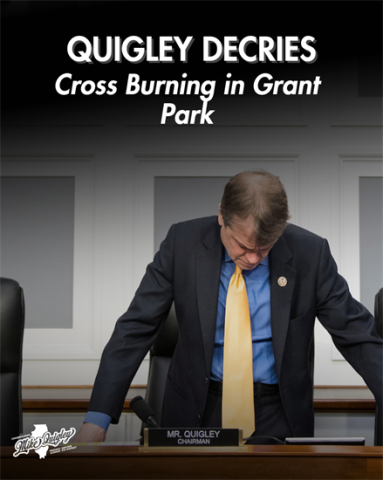 Mike Quigley looking down at desk with caption that reads "Quigley Decries Cross Burning in Grant Park"