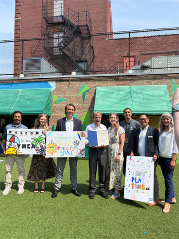Mike Quigley visiting the Irving Park YMCA, standing outside with constituents