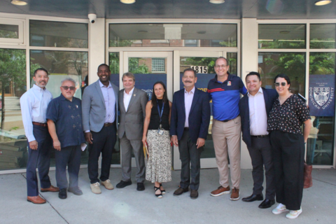 Rep Quigley stands in a row with Rep. Garcia and representatives of the organizations he met with in Pilsen
