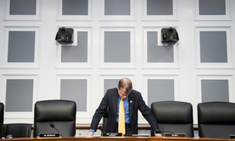 Quigley looks at desk during hearing